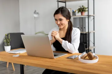 medium-shot-smiley-woman-video-conference-scaled.jpg