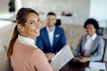 young-happy-woman-having-job-interview-office-scaled.jpg