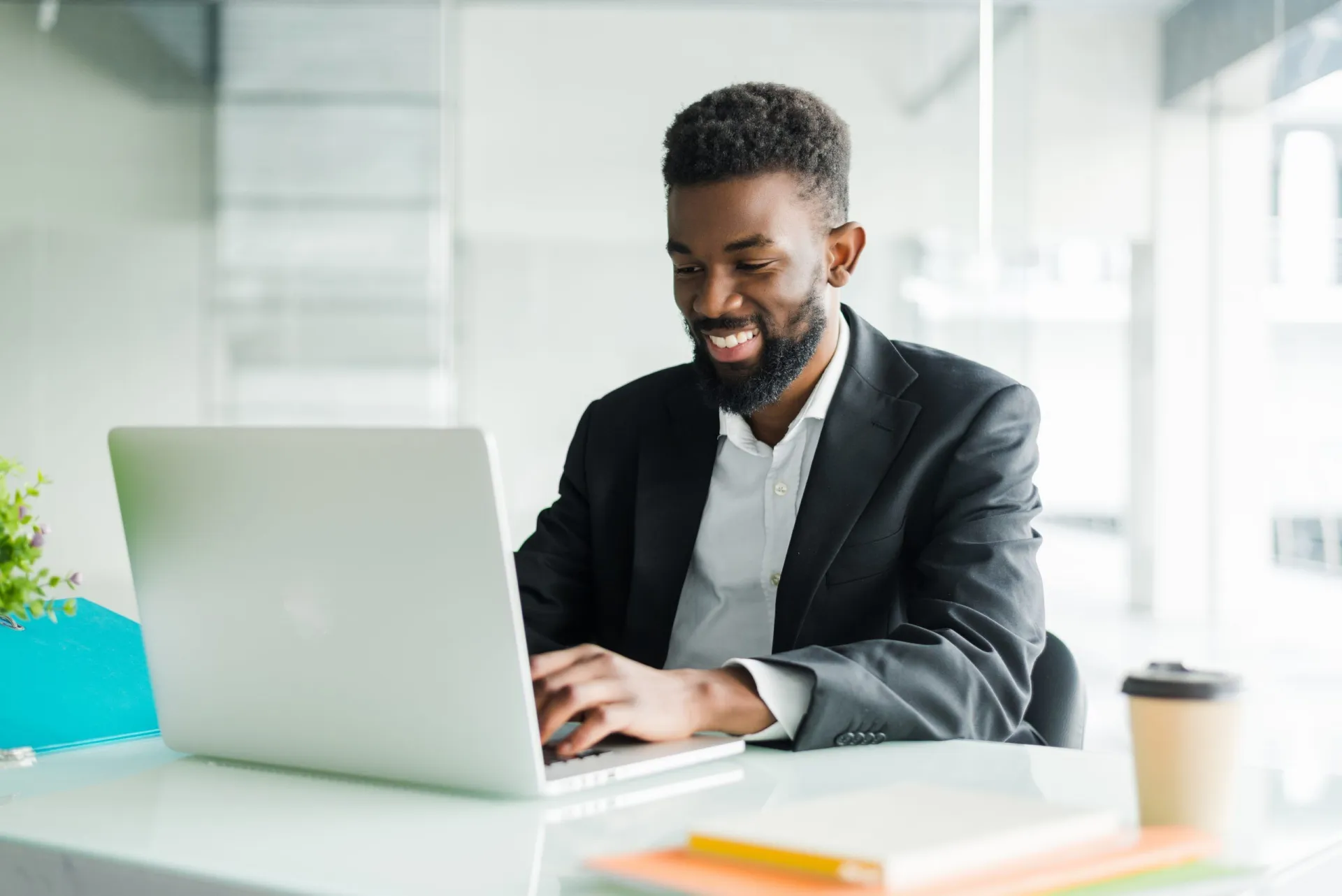 thoughtful-african-american-businessman-using-laptop-pondering-project-business-strategy-puzzled-employee-executive-looking-laptop-screen-reading-email-making-decision-office-scaled.jpg