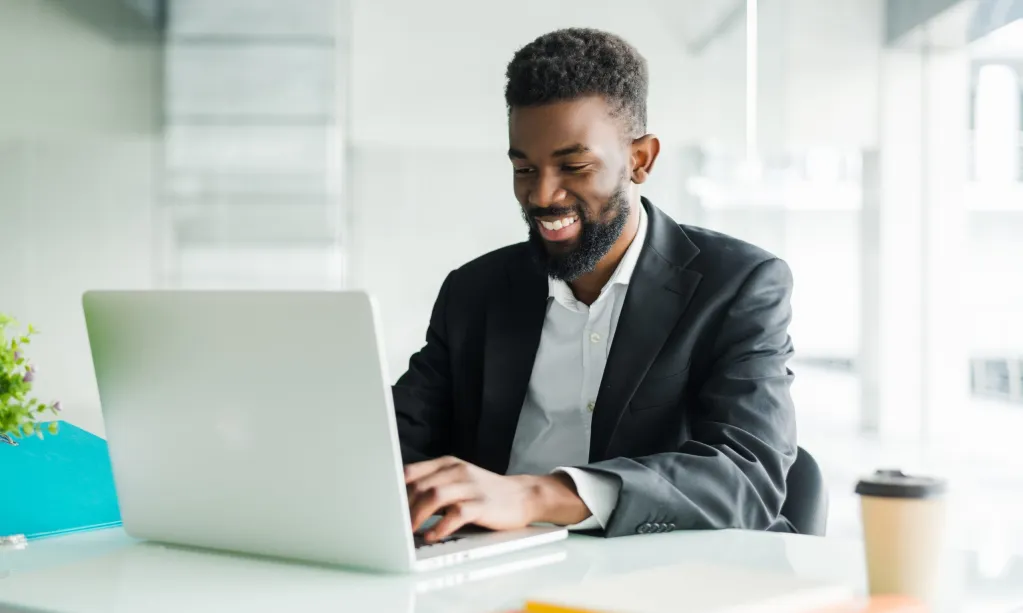 thoughtful-african-american-businessman-using-laptop-pondering-project-business-strategy-puzzled-employee-executive-looking-laptop-screen-reading-email-making-decision-office-scaled.jpg