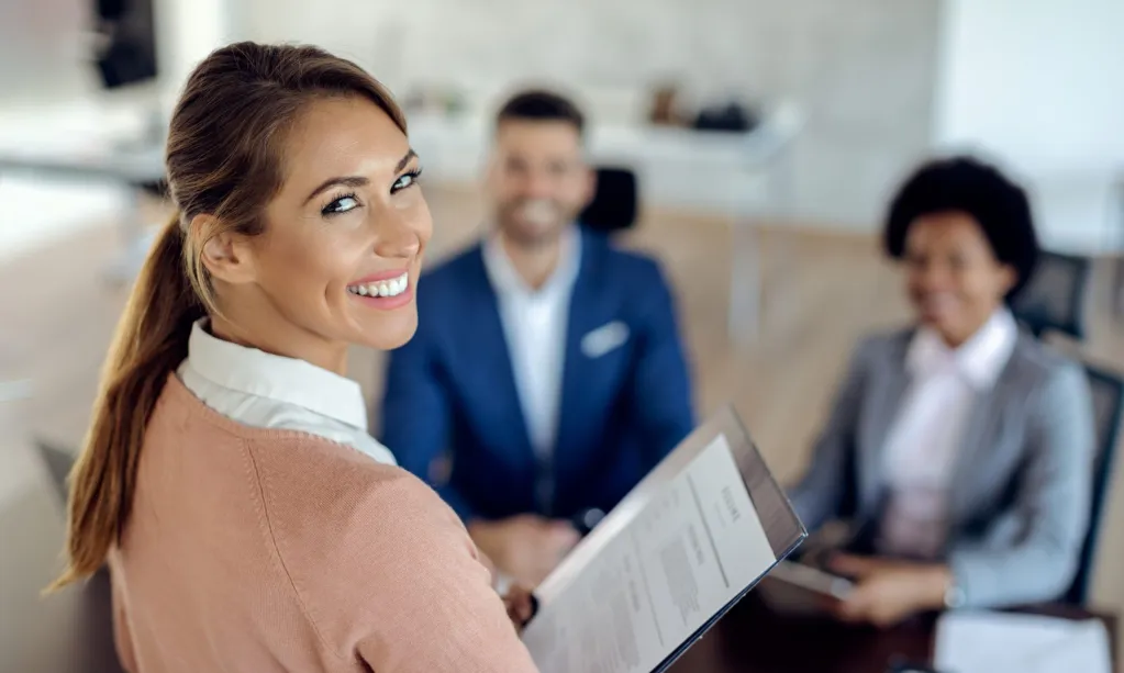 young-happy-woman-having-job-interview-office-scaled.jpg